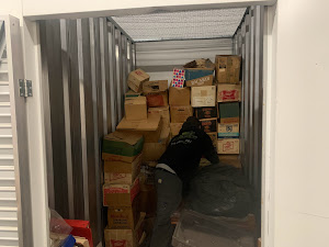 A storage unit or container filled with various boxes and items